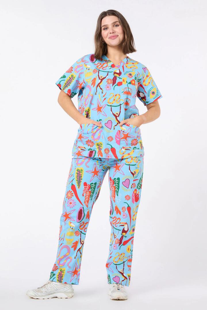 Image of a model wearing Uniforms & Workwear. Product name - Fuego Scrub Set in Blue colour by brand - Gorman
