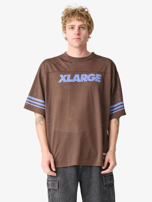 Image of a model wearing Tops. Productname: Xlarge Italic Game Shirt in Mocha colour by brand - Xlarge