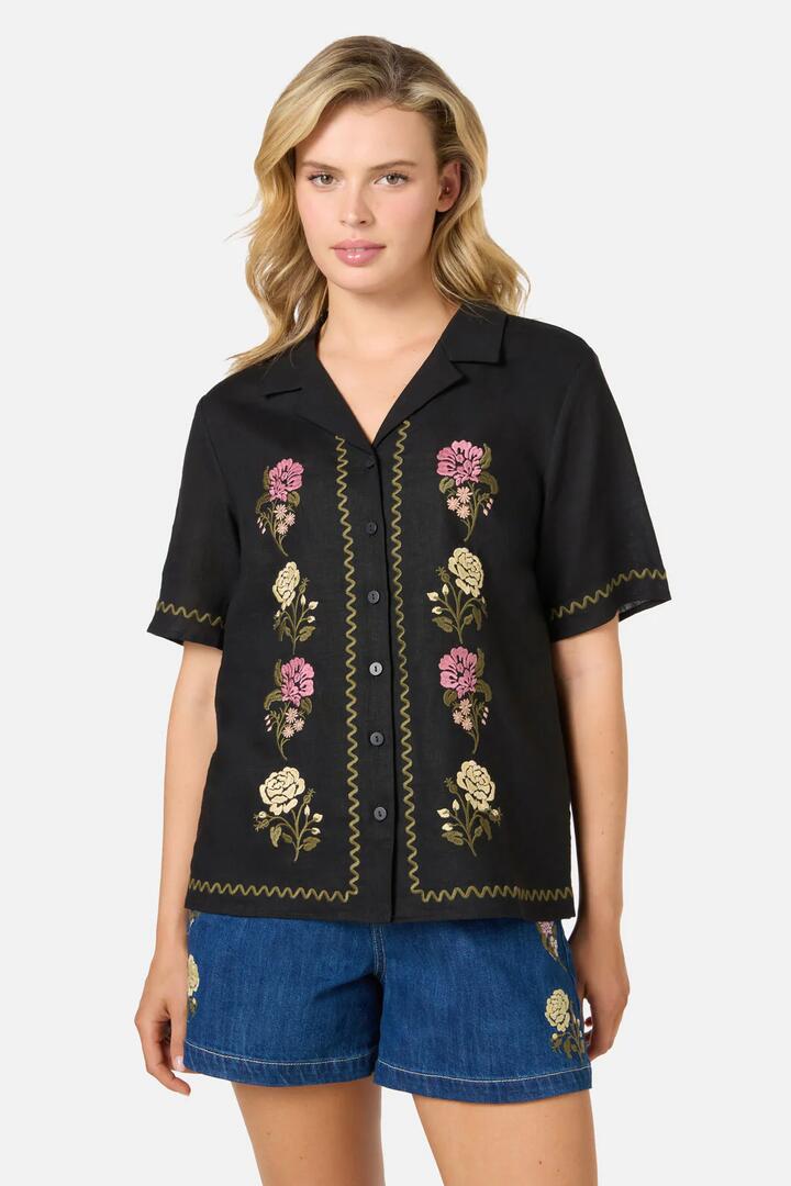 Image of a model wearing Tops. Productname: Astrid Rose Embroidered Shirt in Black colour by brand - Princess Highway