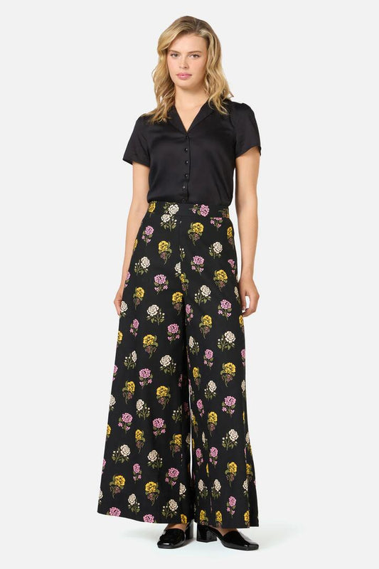 Image of a model wearing Pants. Productname: Astrid Rose Wide Leg Pant in Black colour by brand - Princess Highway