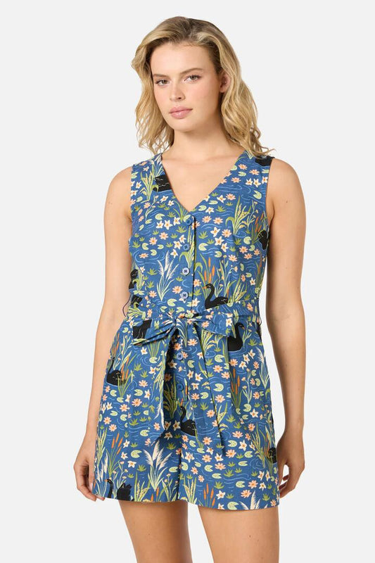 Image of a model wearing Dress. Productname: Pretty Swan Playsuit in Navy colour by brand - Princess Highway