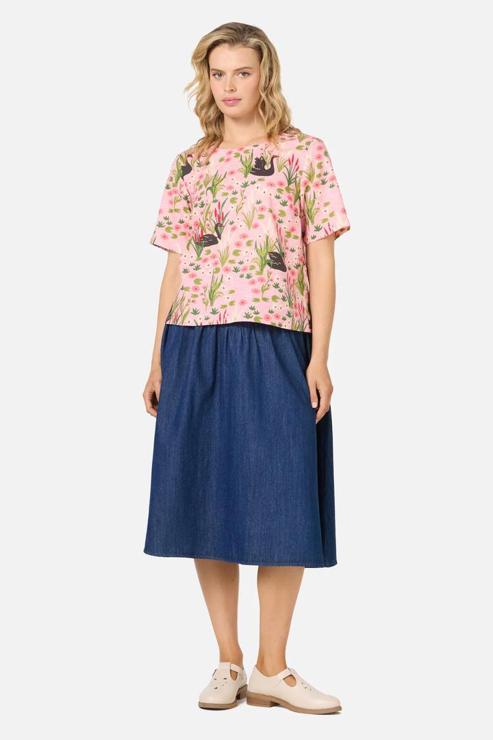 Image of a model wearing Shorts. Productname: Pretty Swan Short Sleeve Top in Pink colour by brand - Princess Highway
