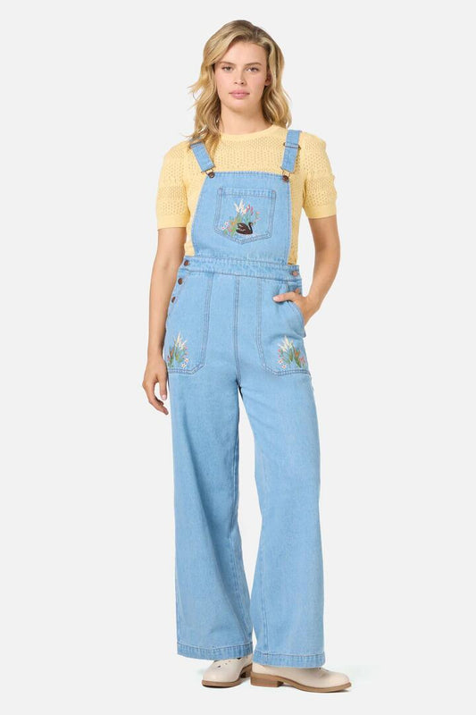 Image of a model wearing Pants. Productname: Swan Embroidered Overall in Blue Denim colour by brand - Princess Highway