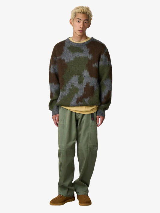 Image of a model wearing Pants. Productname: Gramicci Voyager Pant in Sage colour by brand - Gramicci