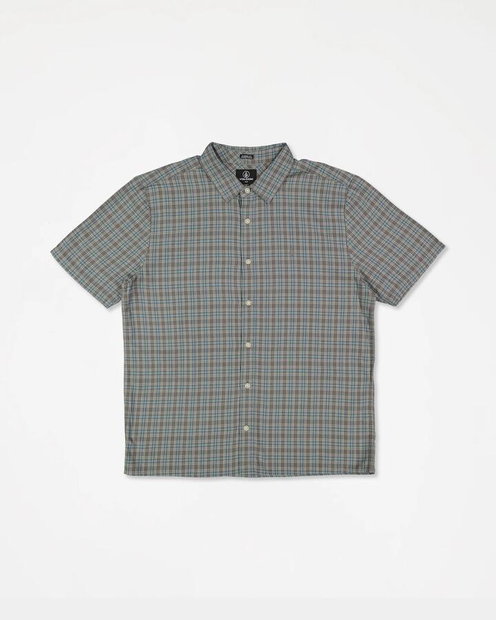 Image of a model wearing Tops. Product name - Volcom Mens Lynnfield Short Sleeve Shirt Pewter in Pewter colour by brand - Volcom