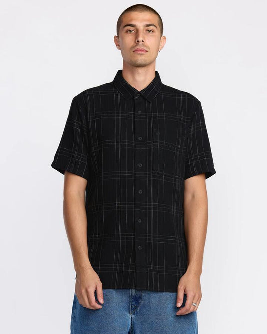 Image of a model wearing Tops. Productname: Volcom - Mens Date Knight Short Sleeve Shirt - Black - in Black colour by brand - Volcom