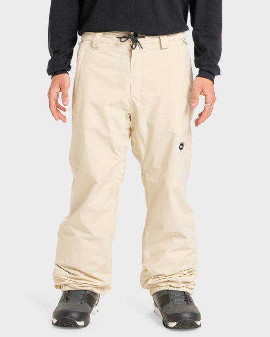 Image of a model wearing Pants. Productname: Quiksilver - Mens Snow Down Snow Pants - Bone - in Bone colour by brand - Quiksilver