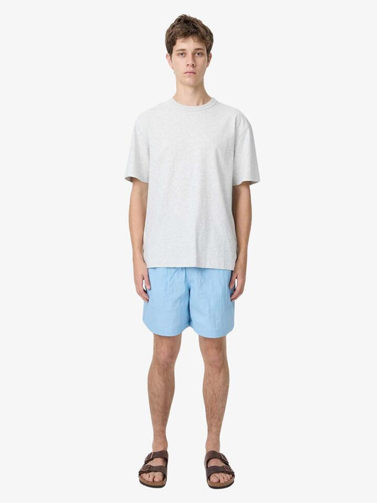 Image of a model wearing Shorts. Productname: Article One Bryn Swim Short in Pale Blue colour by brand - Article One