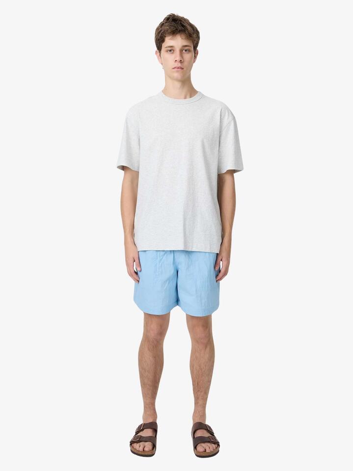 Image of a model wearing Shorts. Productname: Article One Bryn Swim Short in Pale Blue colour by brand - Article One
