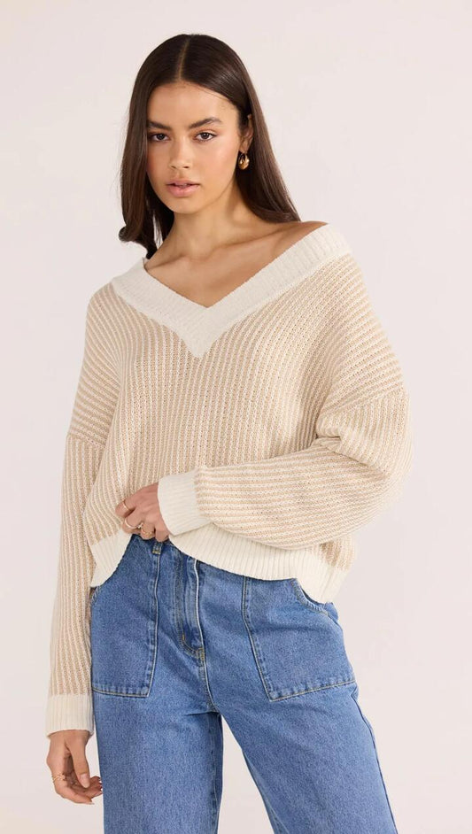 Image of a model wearing Outerwear. Product name - Megan V-Neck Sweater in Beige colour by brand - MINKPINK
