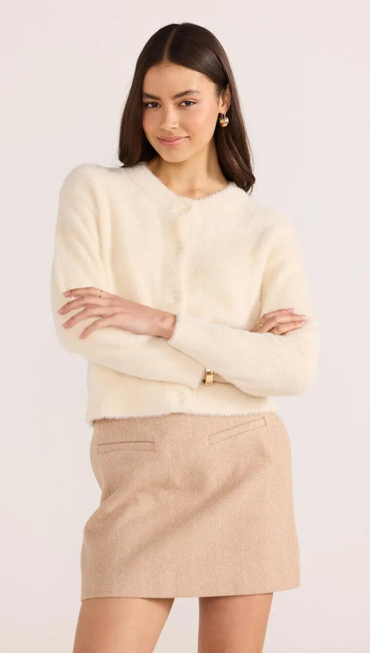 Image of a model wearing Outerwear. Product name - Rowan Fluffy Cardi in Ivory colour by brand - MINKPINK
