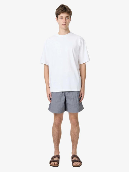 Image of a model wearing Shorts. Productname: Article One Bryn Swim Trunks in Steel colour by brand - Article One