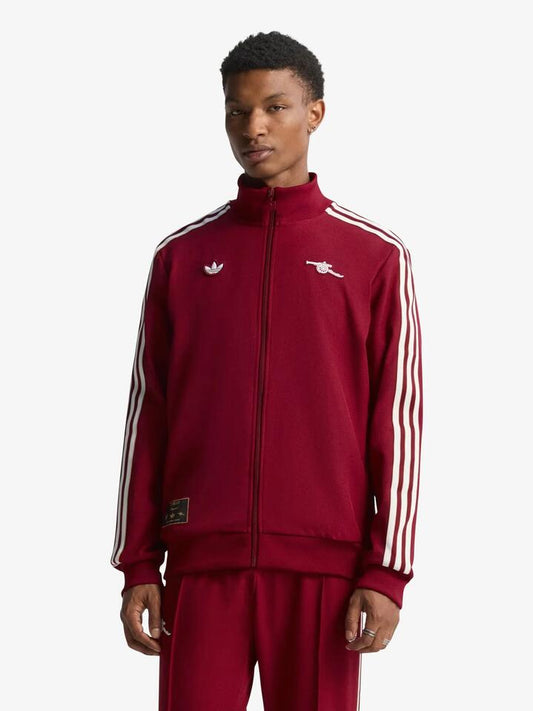 Image of a model wearing Tops. Productname: Adidas Arsenal Terrace Icons Track Top in Team Coll Burgundy colour by brand - Adidas