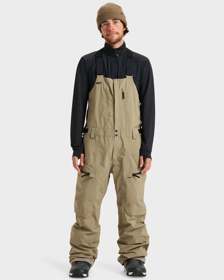 Image of a model wearing Pants. Product name - Quiksilver Mens Altostratus Street Gore-Tex Bib Snow Pants Fallen Rock in Fallen Rock colour by brand - Quiksilver