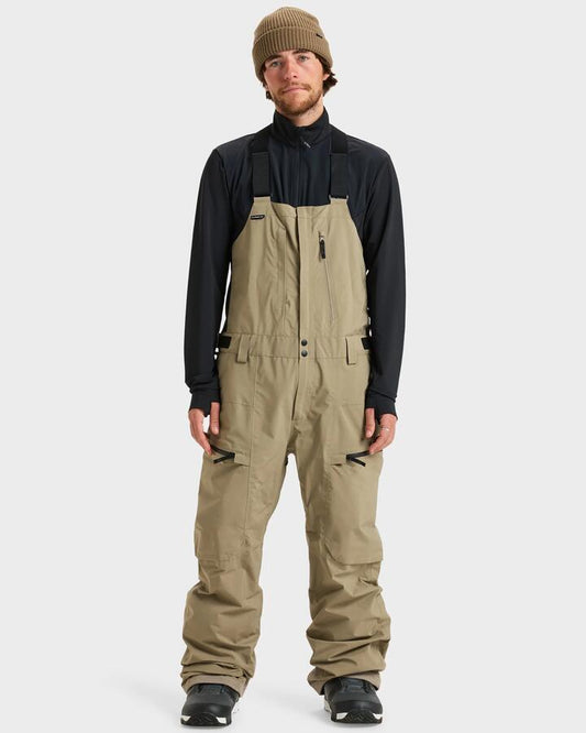 Image of a model wearing Pants. Product name - Quiksilver Mens Altostratus Street Gore-Tex Bib Snow Pants Fallen Rock in Fallen Rock colour by brand - Quiksilver