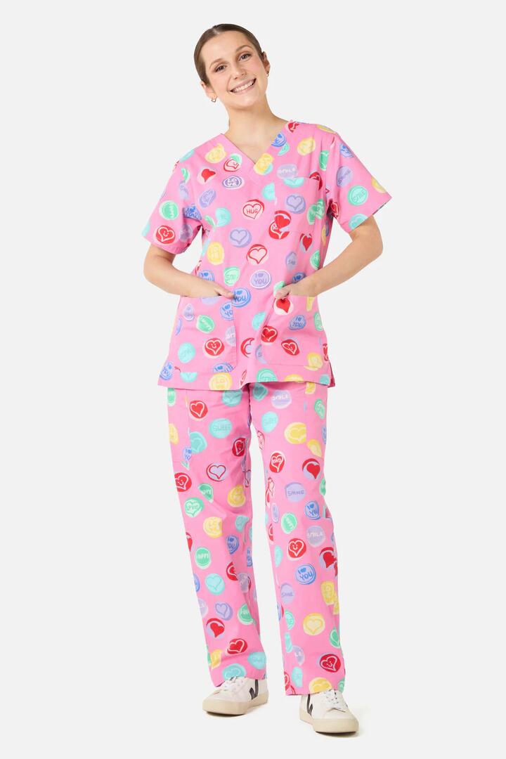 Image of a model wearing Uniforms & Workwear. Product name - Love Candy Scrub set in Pink colour by brand - Gorman