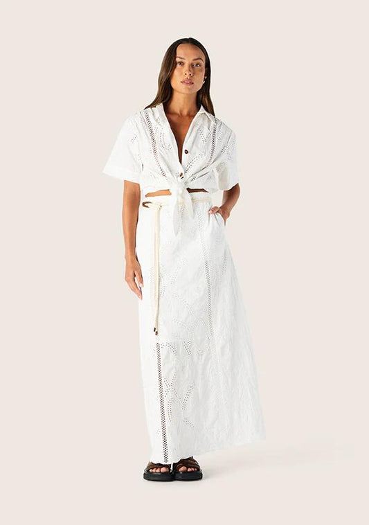 Image of a model wearing Skirts. Productname: Alicia Maxi Skirt | MOS The Label in Optic White colour by brand - MOS The Label
