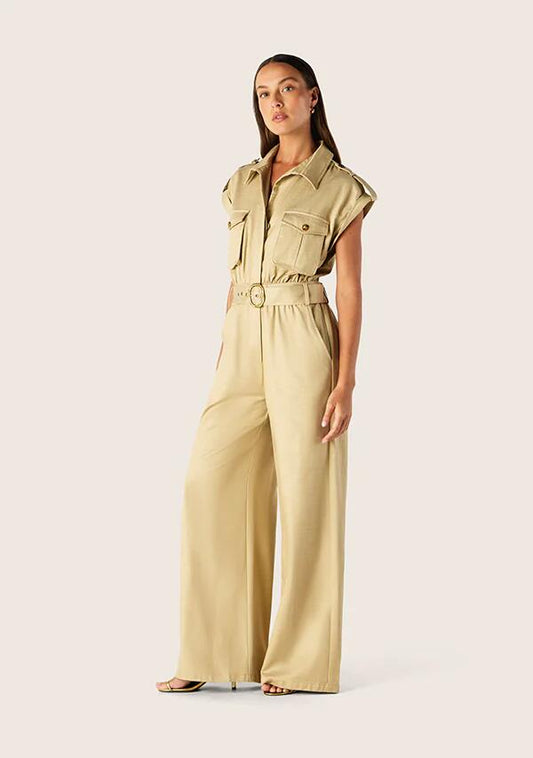 Image of a model wearing Outerwear. Productname: Rita Jumpsuit Beige | MOS The Label in Classic Beige colour by brand - MOS The Label