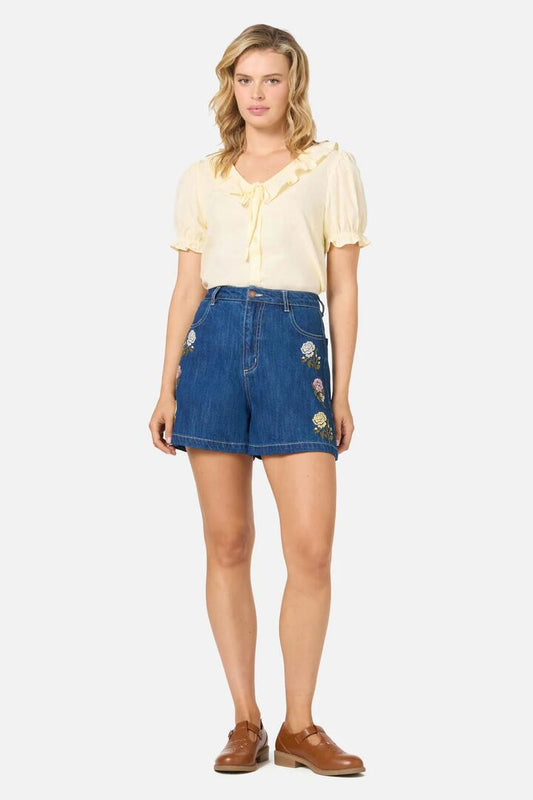 Image of a model wearing Shorts. Productname: Astrid Rose Embroidered Short in Blue Denim colour by brand - Princess Highway