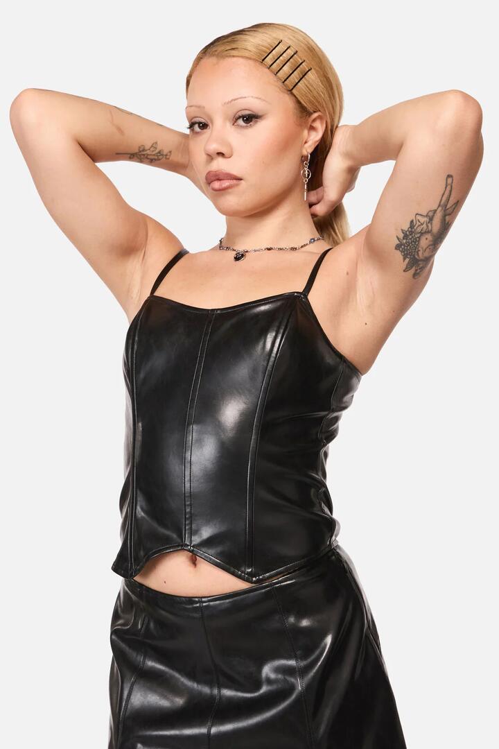 Image of a model wearing Tops. Productname: Trickz Pu Punk Top in Black colour by brand - Black Friday