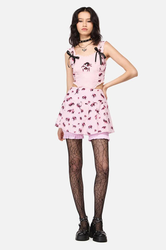 Image of a model wearing Skirts. Productname: Rococo Life Spider Print Bow Bloomer Skort in Pink colour by brand - Dangerfield
