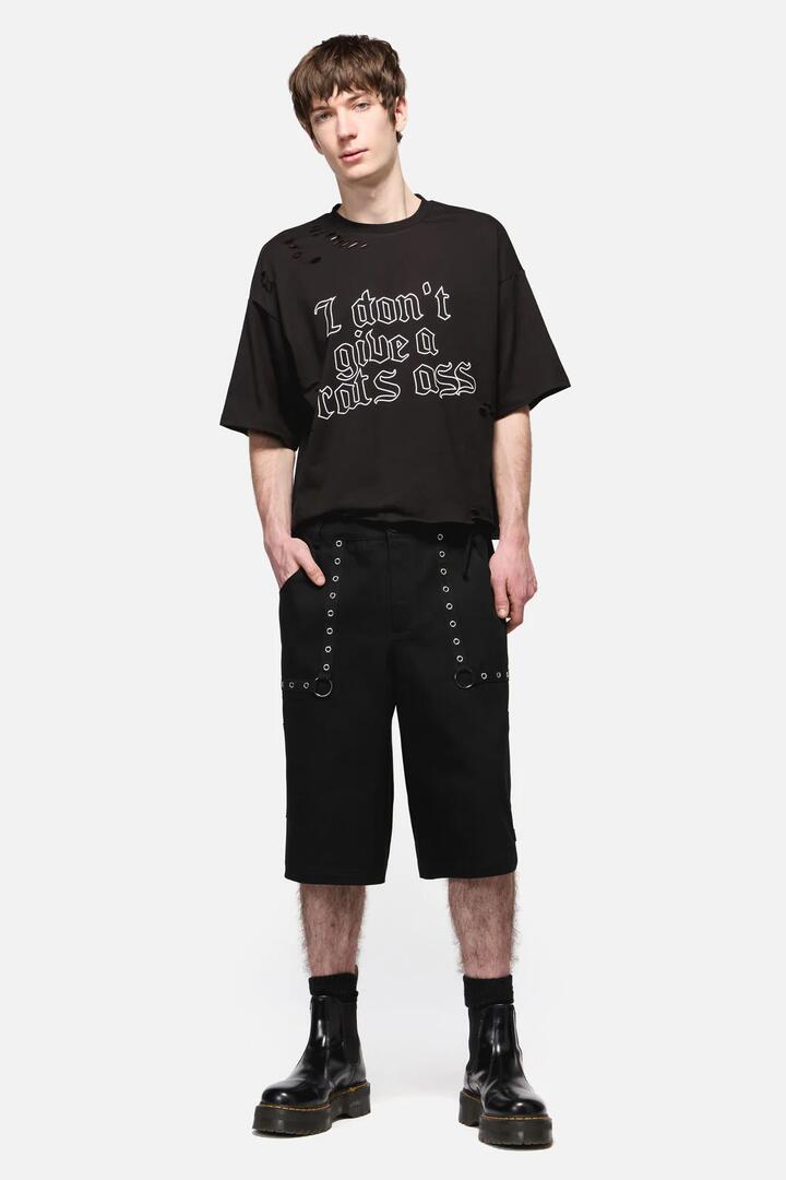 Image of a model wearing Shorts. Productname: Trickz Punk Jorts in Black colour by brand - Black Friday