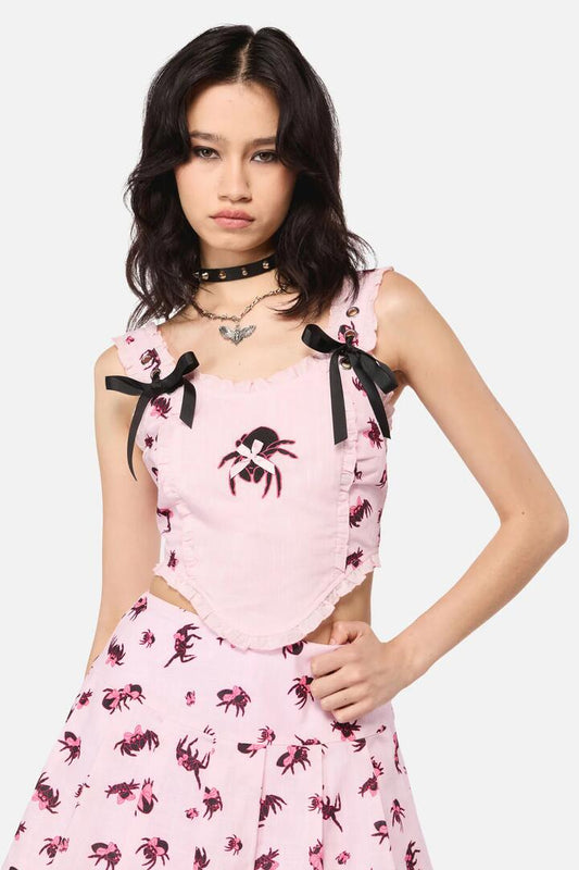 Image of a model wearing Tops. Product name - Rococo Life Spiider Bow Print in Pink colour by brand - Dangerfield