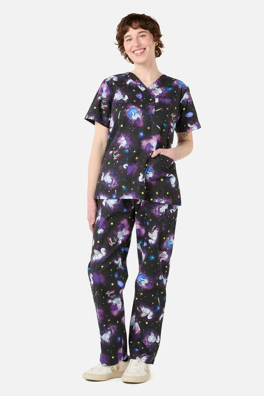 Image of a model wearing Uniforms & Workwear. Productname: Magic Cats Scrub Set in Purple colour by brand - Scrubs With Love