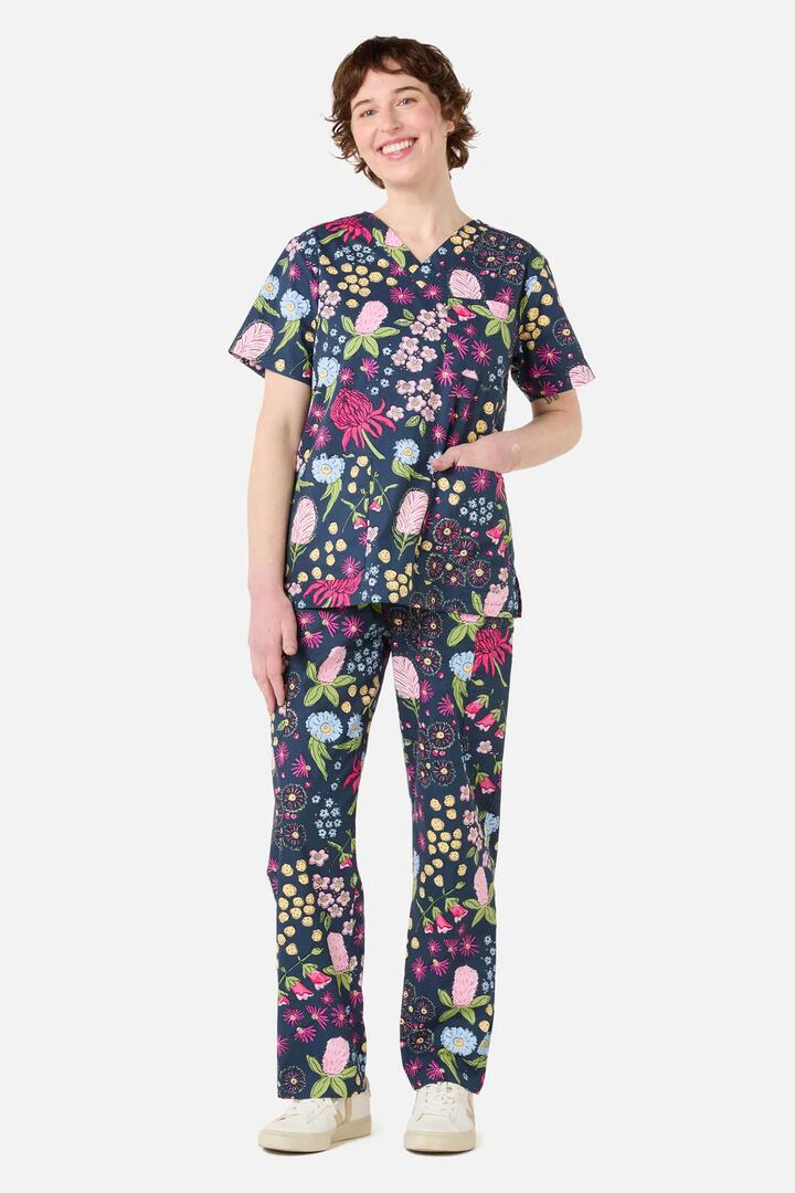 Image of a model wearing Uniforms & Workwear. Productname: Native Bouquet Scrub Set in Navy colour by brand - Scrubs With Love