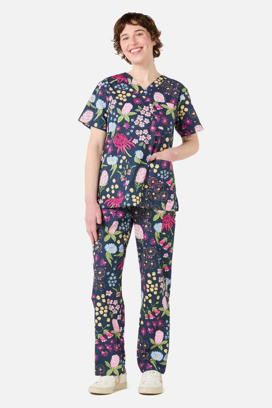 Image of a model wearing Uniforms & Workwear. Productname: Native Bouquet Scrub Set in Navy colour by brand - Scrubs With Love