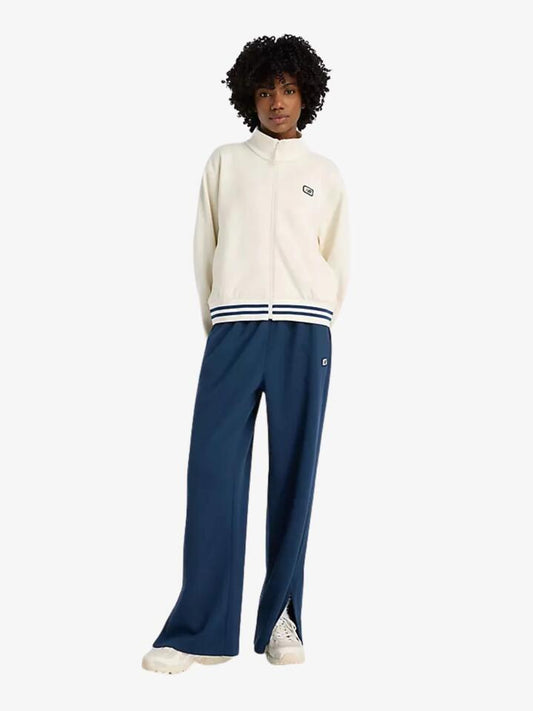 Image of a model wearing Pants. Productname: New Balance Post Season Pique Track Pants in Nb Navy colour by brand - New Balance