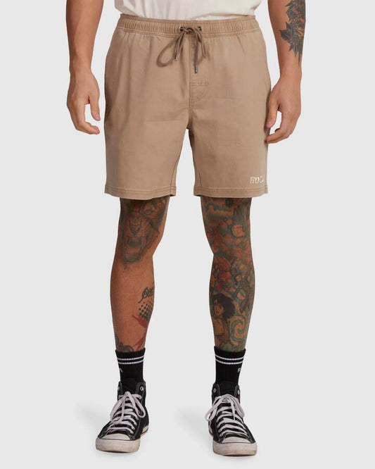Image of a model wearing Shorts. Product name - RVCA Mens Escape Elastic Exotica Walkshorts Timber in Timber colour by brand - RVCA