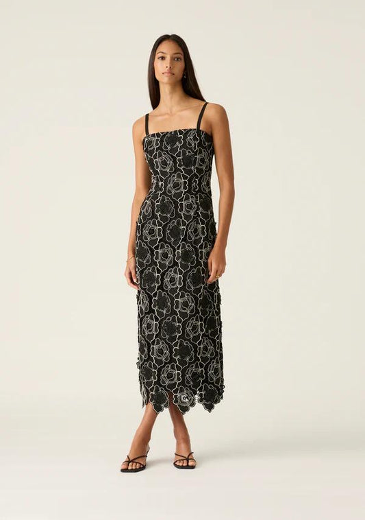 Image of a model wearing Dress. Productname: Dahlia Lace Midi Dress in Black colour by brand - MOS The Label
