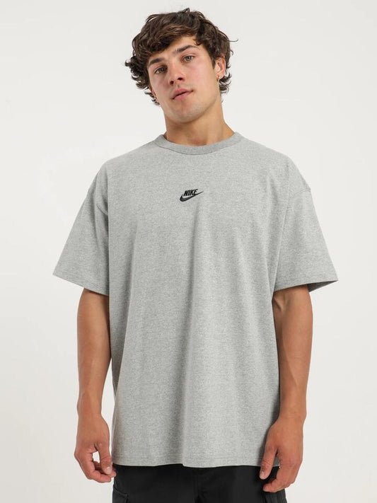 Image of a model wearing Tops. Productname: Nike Sportswear Premium Essentials T-Shirt in Grey colour by brand - Nike