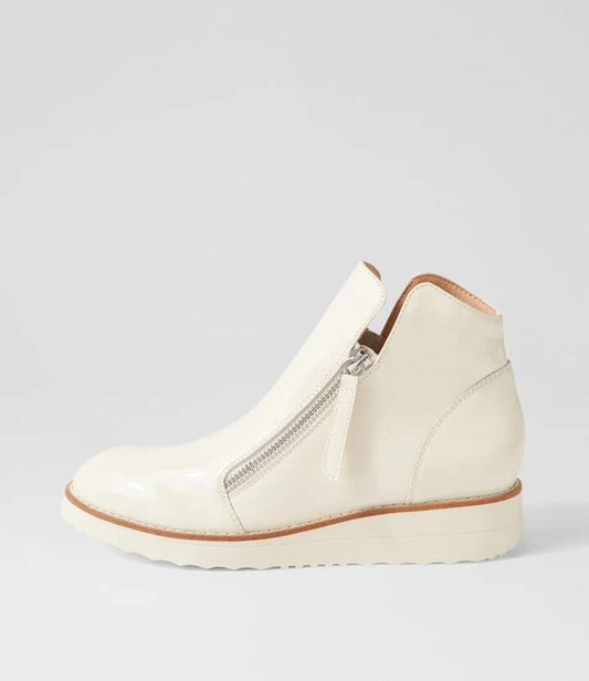 Image of Boots. Productname: Olise Ivory Patent Leather Ankle Boots in IVORY-IVORY SOLE colour by brand - MIDAS