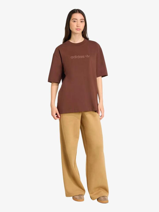 Image of a model wearing Tops. Productname: Adidas Essentials Linear Oversized Tee in Auburn colour by brand - Adidas