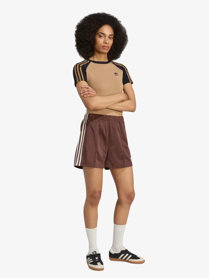 Image of a model wearing Shorts. Productname: Adidas Firebird Short in Auburn/Cream White colour by brand - Adidas