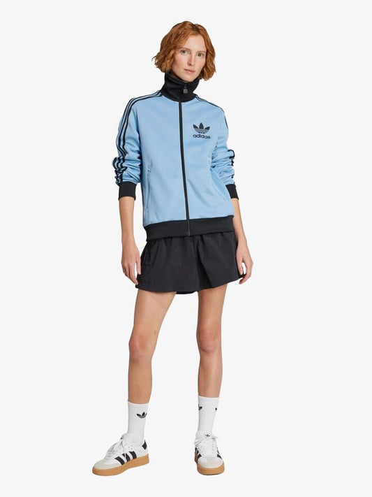 Image of a model wearing Tops. Productname: Adidas Heritage Track Top in ash blue/black colour by brand - Adidas