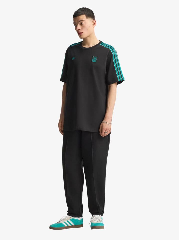 Image of a model wearing Tops. Productname: Adidas Liverpool FC Icon Tee in Black colour by brand - Adidas