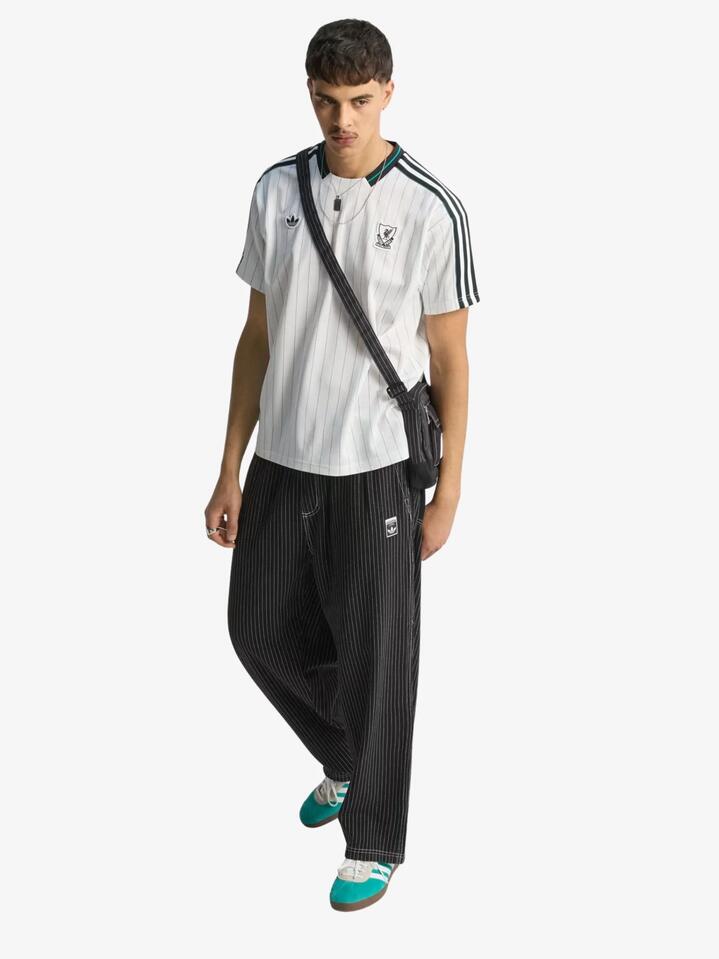 Image of a model wearing Tops. Productname: Adidas Liverpool FC Icon Jersey in White/Sea Green colour by brand - Adidas