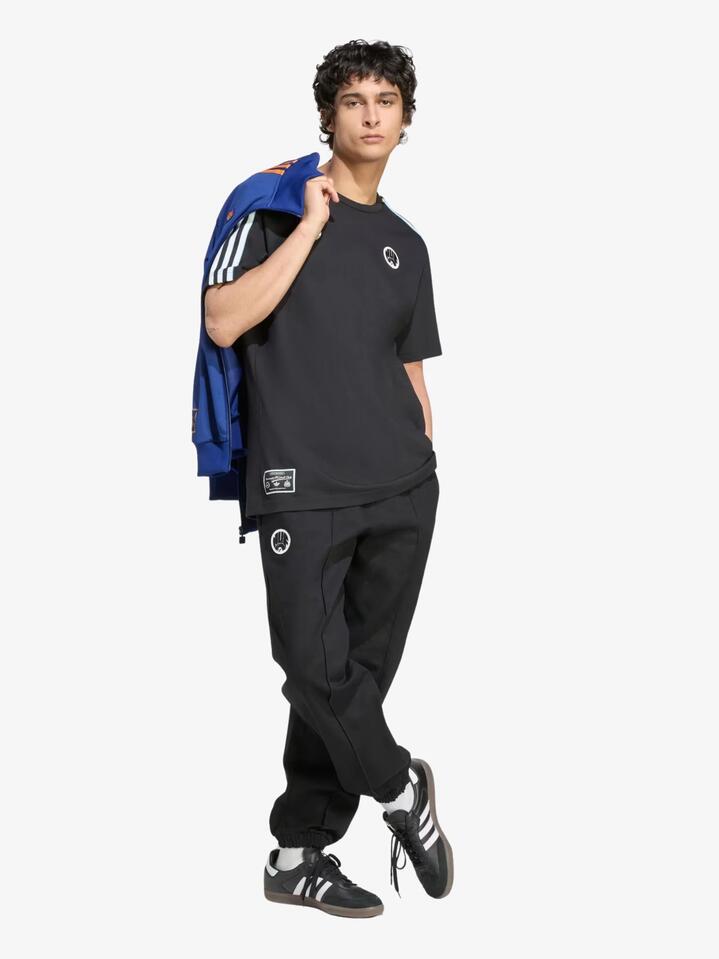 Image of a model wearing Tops. Productname: Adidas Newcastle United FC Icon Tee in Black colour by brand - Adidas