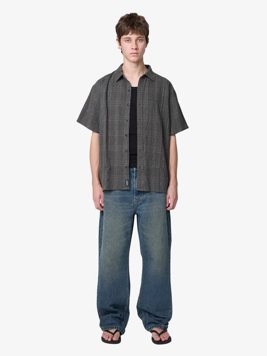 Image of a model wearing Shorts. Productname: Thrills Built To Win Short Sleeve Shirt in Oil Grren colour by brand - Thrills
