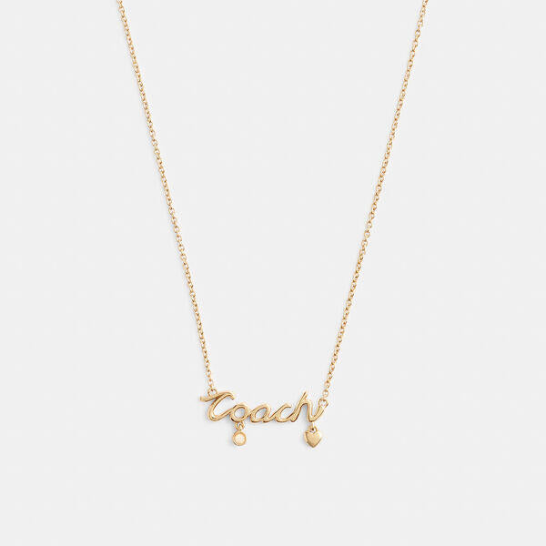 Image of Necklaces. Productname: Coach Script Heart Necklace in GOLD colour by brand - Coach Outlet Australia