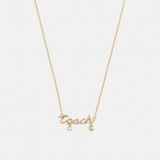 Image of Necklaces. Productname: Coach Script Heart Necklace in GOLD colour by brand - Coach Outlet Australia