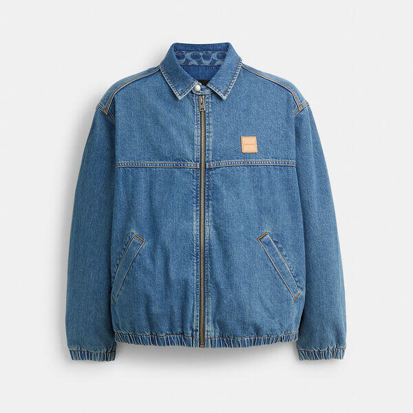 Image of a model wearing Outerwear. Productname: Denim Zip Jacket in BLUE colour by brand - Coach Outlet Australia