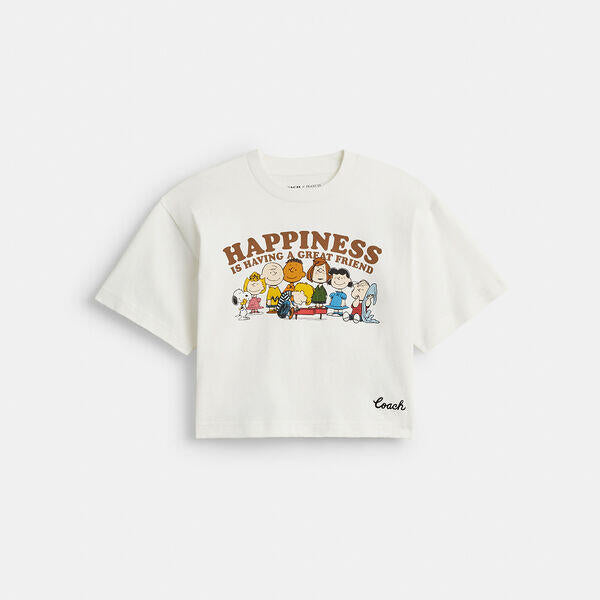 Image of a model wearing Tops. Productname: Coach X Peanuts Cropped T-Shirt In Organic Cotton in WHITE colour by brand - Coach Outlet Australia