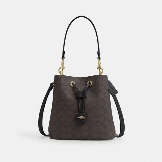 Image of Bags. Productname: Rowan Bucket Bag In Signature Canvas in IM/WALNUT/BLACK colour by brand - Coach Outlet Australia