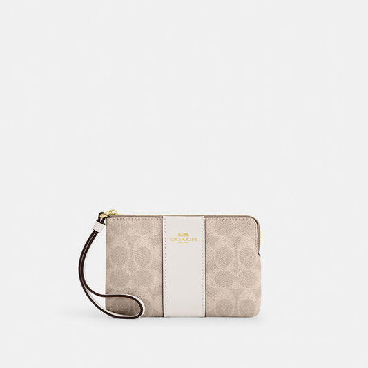 Image of Accessories. Productname: Corner Zip Wristlet In Signature Canvas With Stripe in IM/SAND/CHALK colour by brand - Coach Outlet Australia