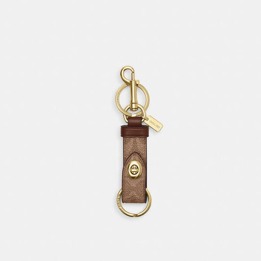 Image of Charms. Productname: Trigger Snap Bag Charm In Signature Canvas in IM/TAN/BROWN colour by brand - Coach Outlet Australia