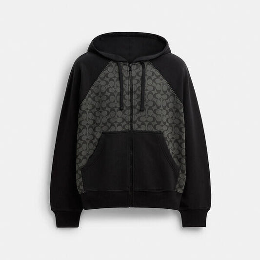 Image of a model wearing Outerwear. Productname: Signature Zip Hoodie in CHARCOAL SIGNATURE colour by brand - Coach Outlet Australia